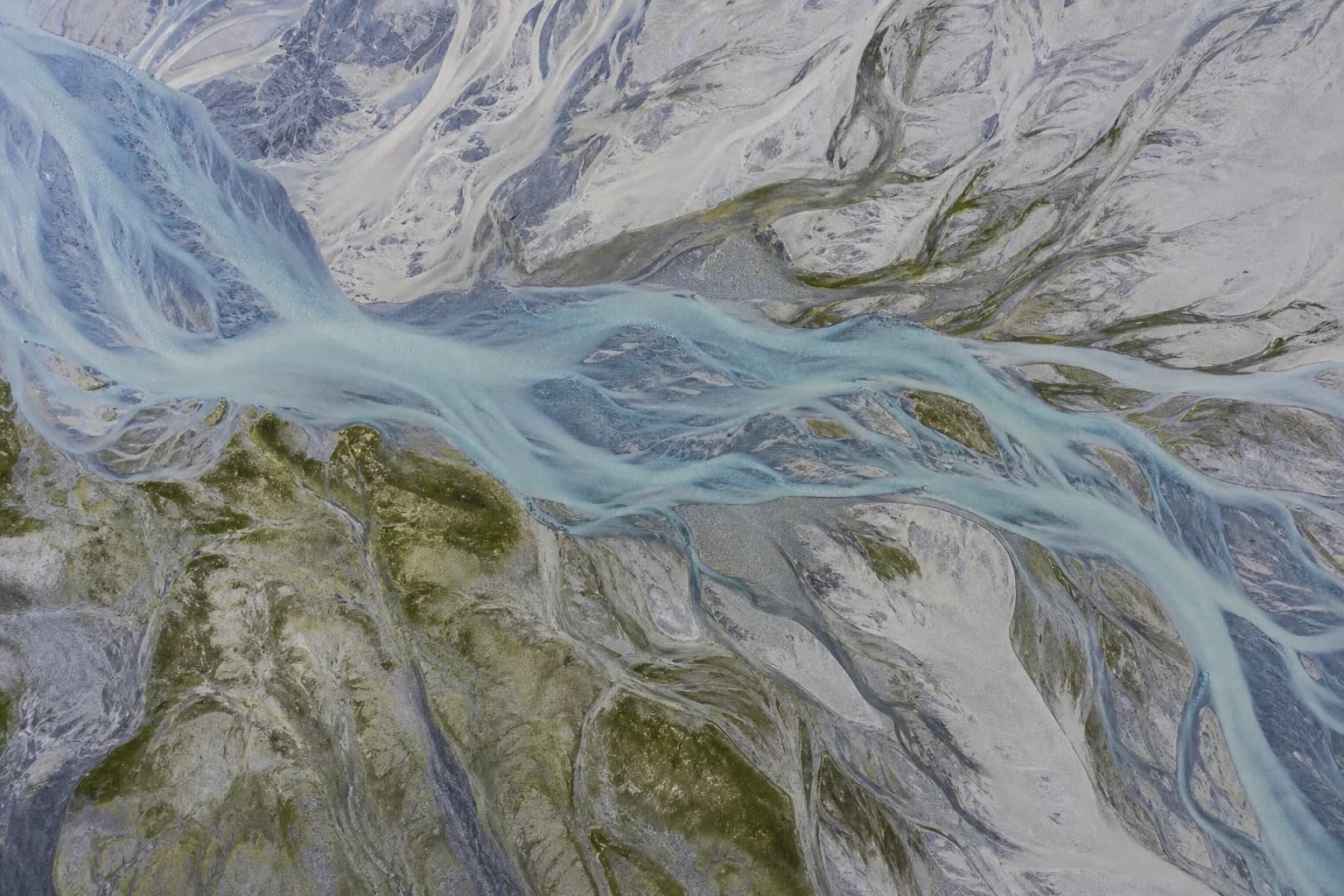Natural river delta patterns branching across a landscape